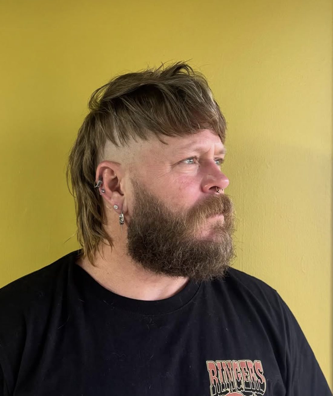 Client with a textured mullet haircut, styled at Spunk